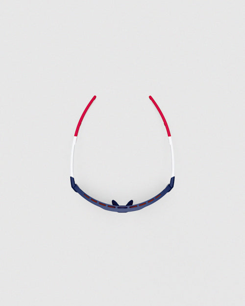 This is a top-down view of the Ranger Duster - Impact Stars & Stripes shooting sunglasses, showcasing the wraparound structure of the lightweight, full-rim TR90 frame.