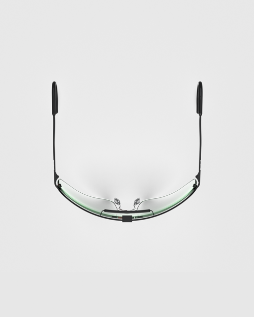 A top-down view showcases the ergonomic wrap-around profile of the matte black Ranger Falcon Pro Frame Shooting Sunglasses, highlighting the curved continuous shield lens, adjustable nose pads, and sleek temples designed for a secure fit.