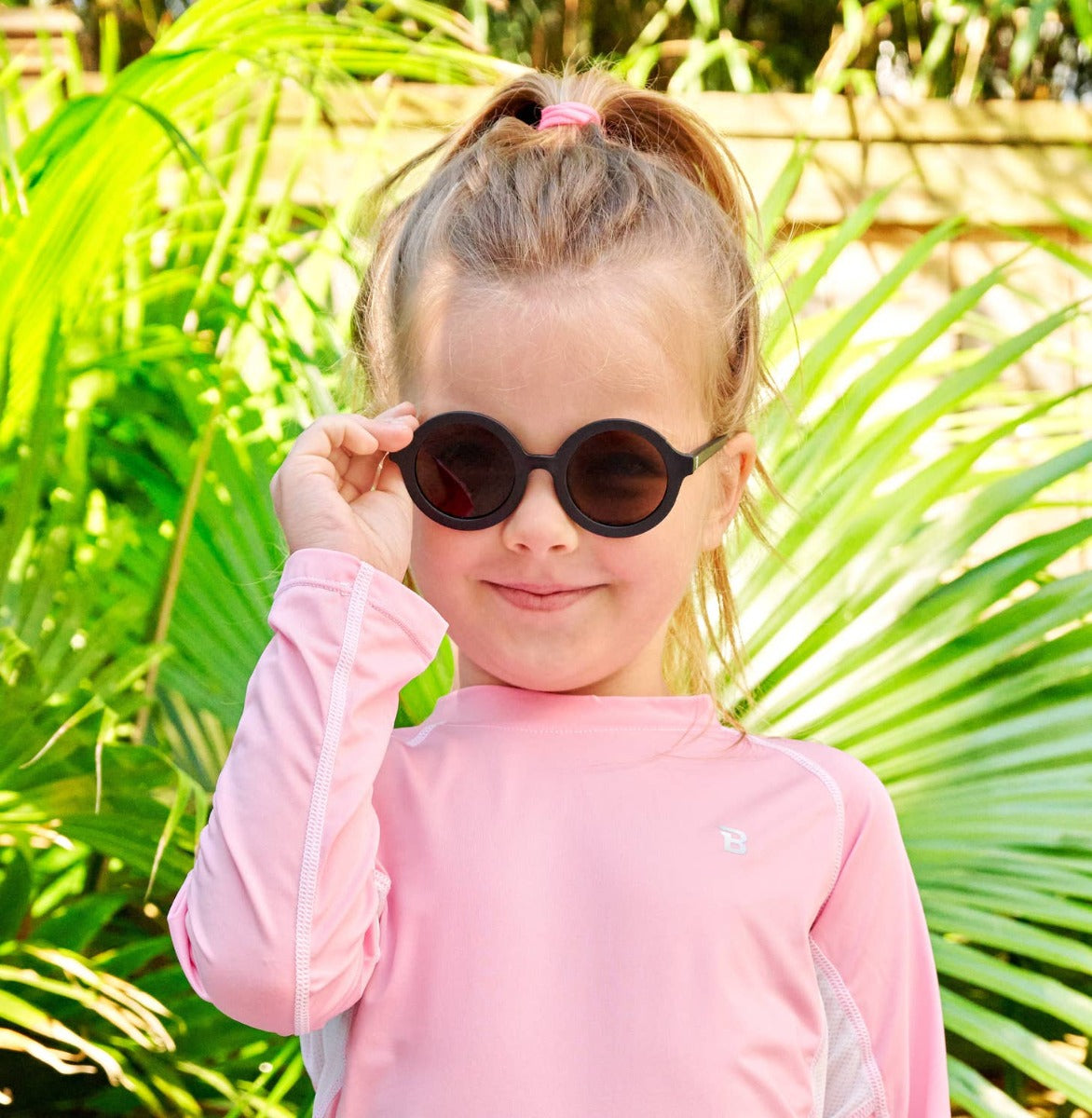 Girl wearing Babiators Euro Round sunglasses