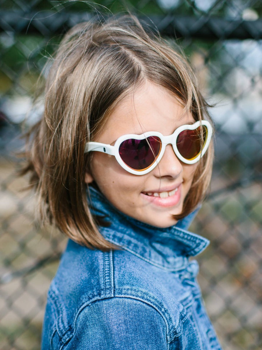 Child wearing Babiators Hearts sunglasses