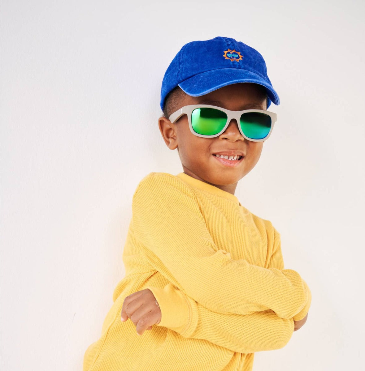 Kid wearing Babiators Navigator sunglasses