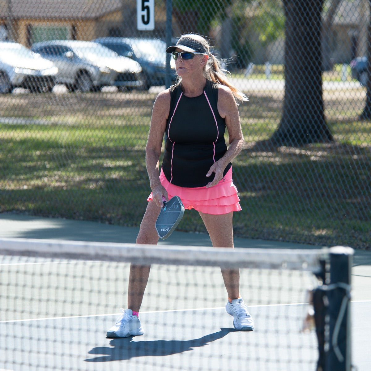 Woman wearing Dink Naples Pickleball sunglasses