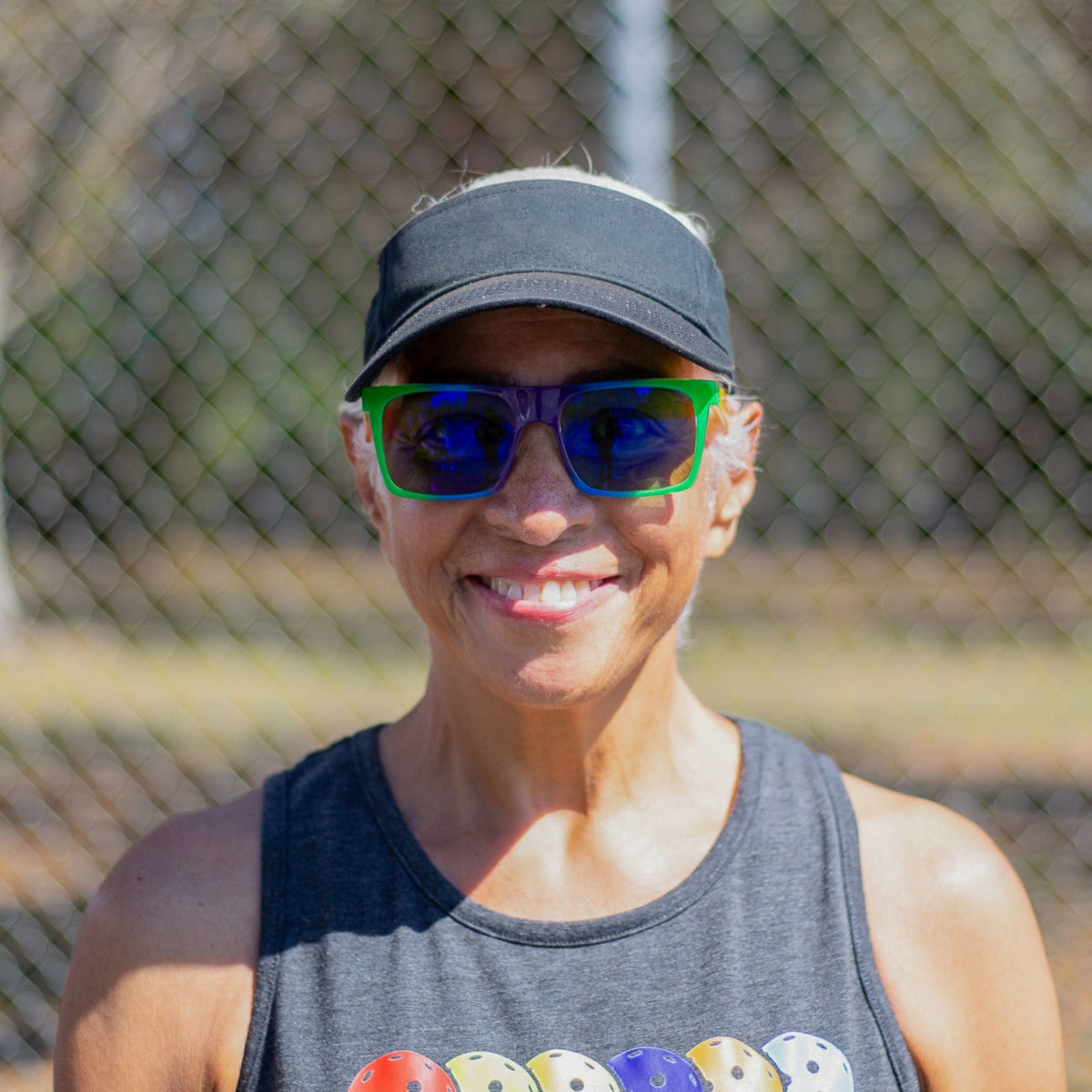 Person wearing Dink Sanibel pickleball sunglasses