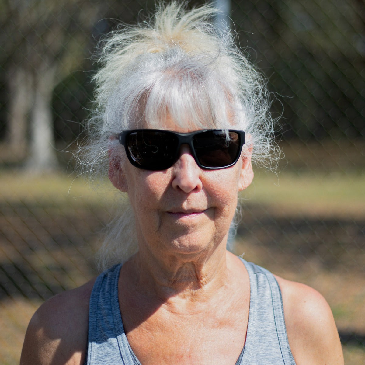 Woman wearing Dink Orlando pickleball sunglasses