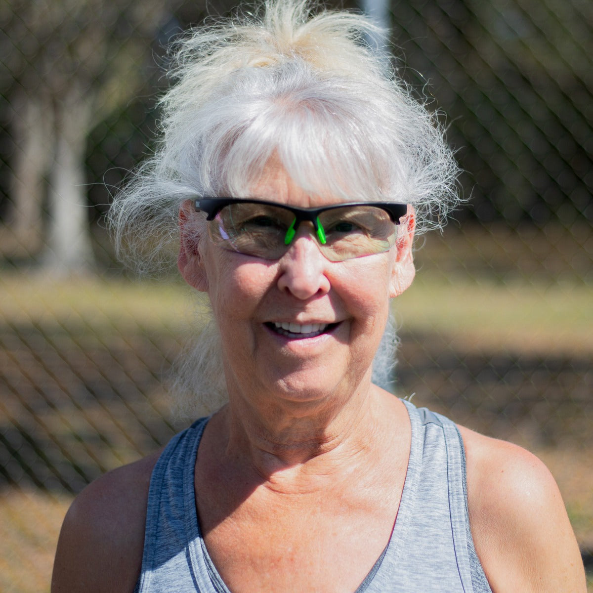 Person wearing Daytona pickleball sunglasses