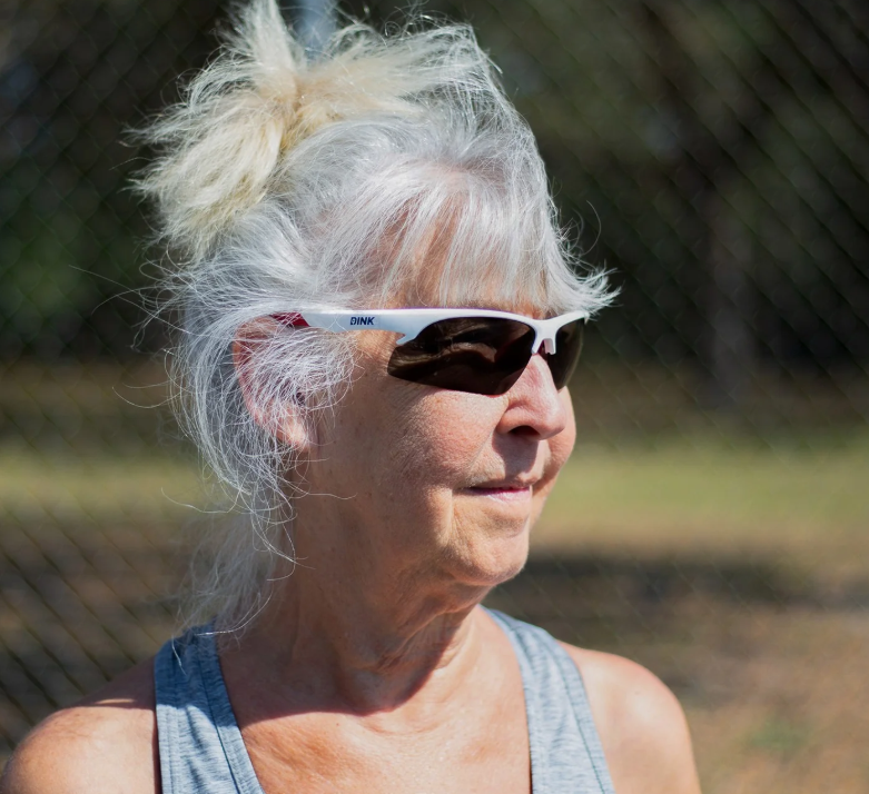 Woman wearing Dink Daytona Petite pickleball sunglasses