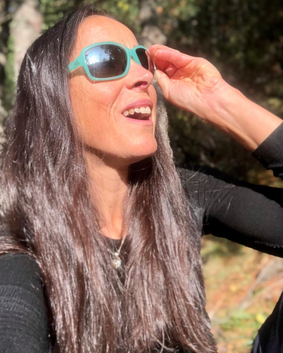 Person wearing Evil Eye Nook sunglasses