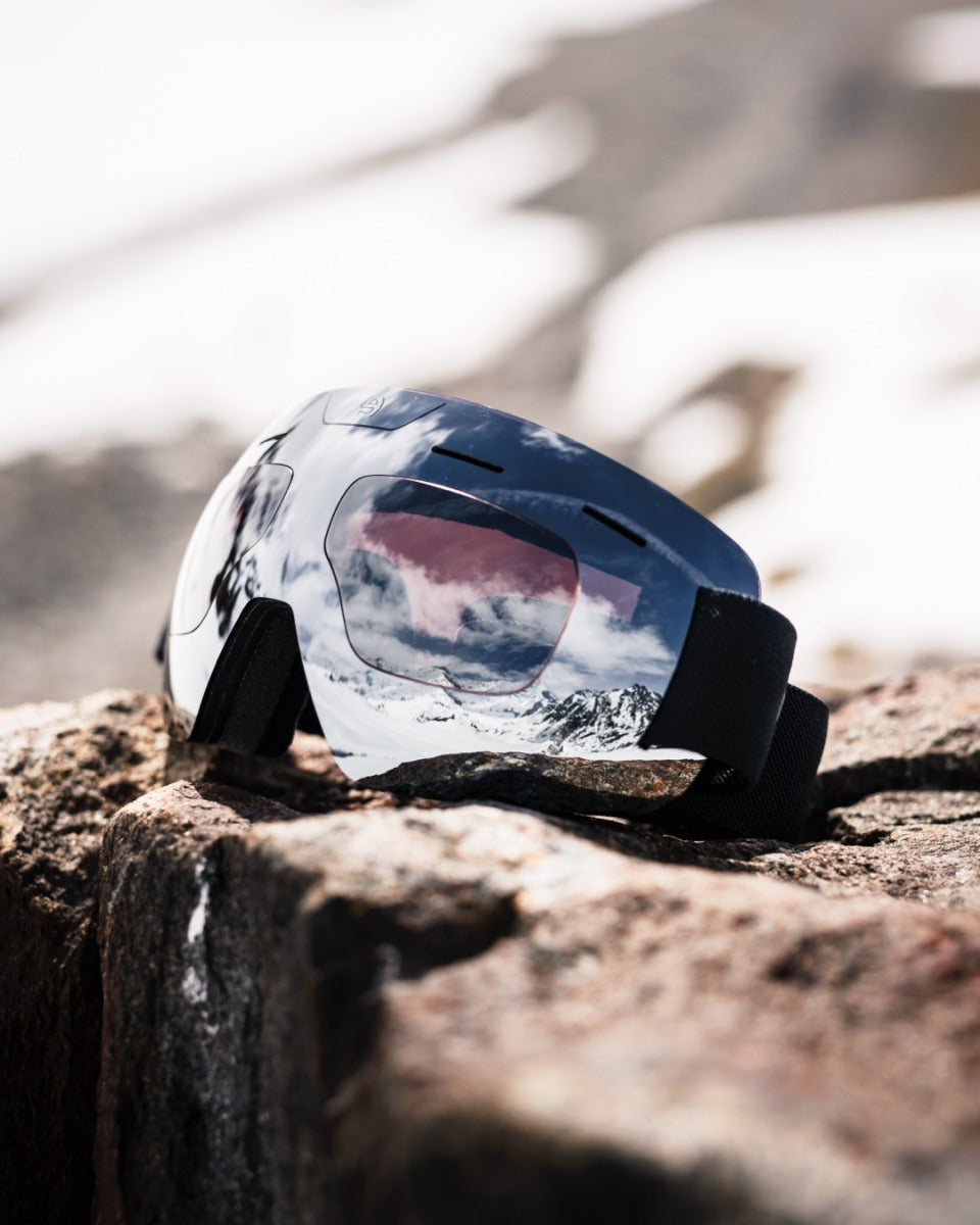 Evil Eye Peaklite ski goggles on a rock
