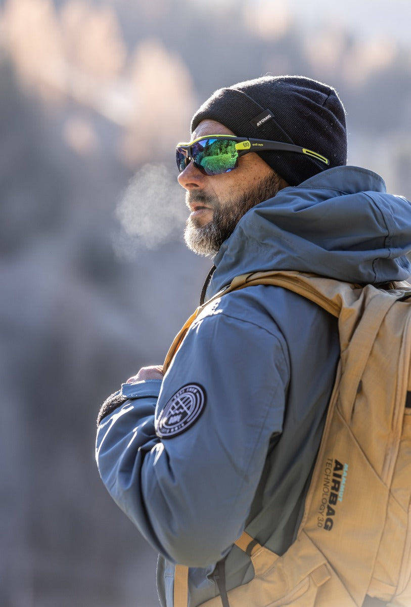 Person wearing Evil Eye Trace Ng Pro sunglasses