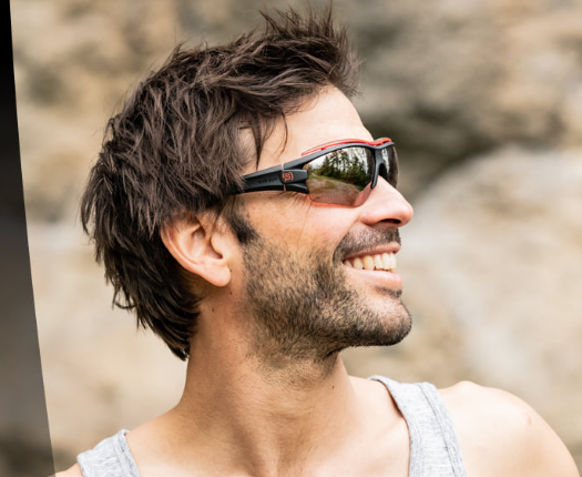 Person wearing Evil Eye Trace Pro sunglasses