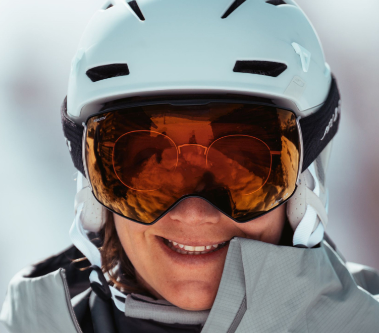 Person wearing Julbo Lightyear OTG ski goggles over eyeglasses