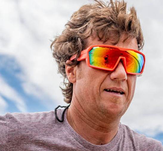 Person wearing Ocean Chameleon watersport sunglasses