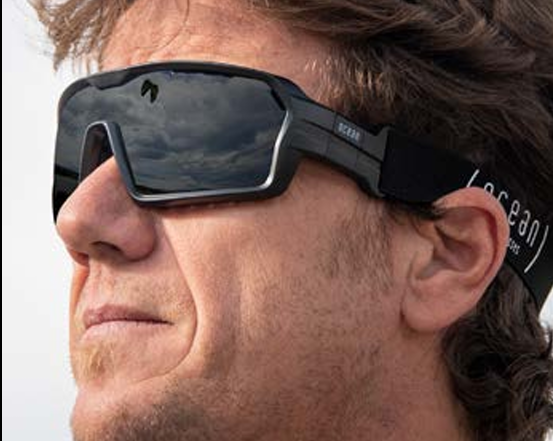 Ocean Chameleon watersport sunglasses on a person with the full strap