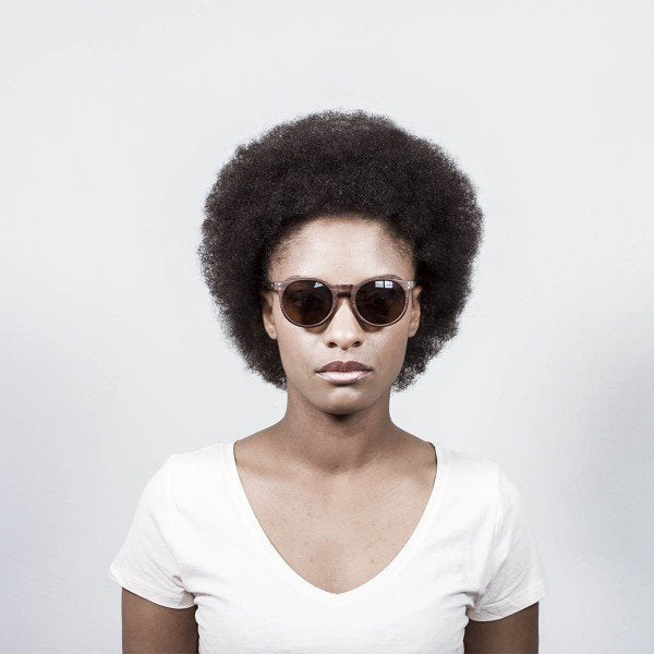 Woman wearing Ocean Lizard Wood sunglasses