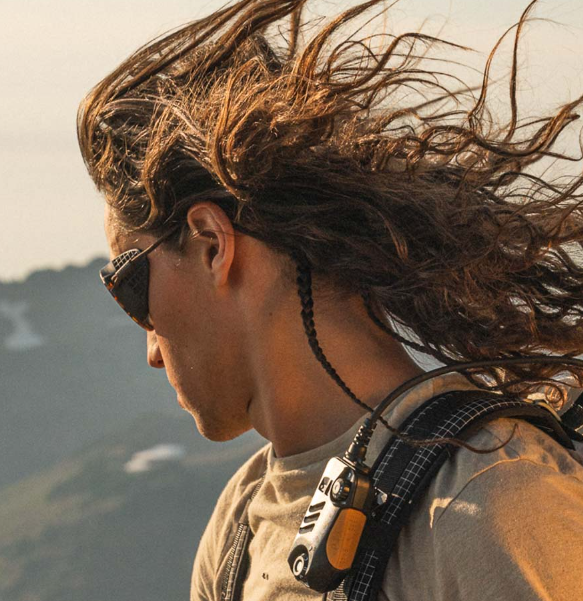 Person wearing Ombraz sunglasses with side shields