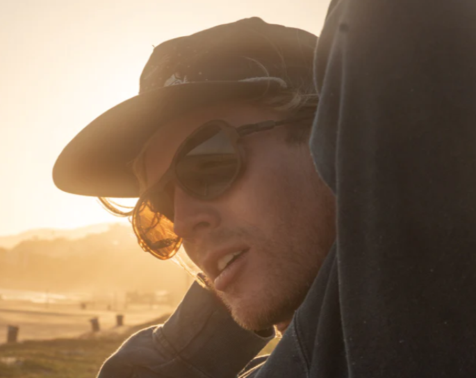 Person wearing Ombraz Teton sunglasses