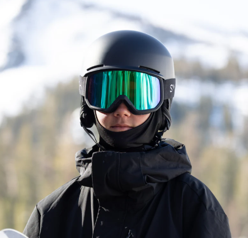 Person wearing Smith Transfer ski goggles