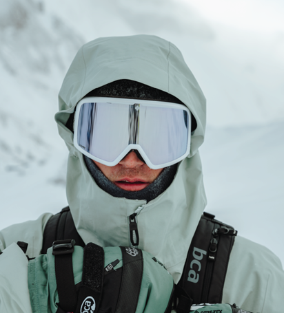 Person wearing Spy Megalith ski goggles